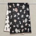 A black women scarf with ginkgo leaf pattern is hanging on clothing rack, The cashmere-feel fabric is very soft, warm and with high-quality workmanship. This fashion scarf is reversible and large size, approx. width 65 cm, length 180 cm and weight 330g