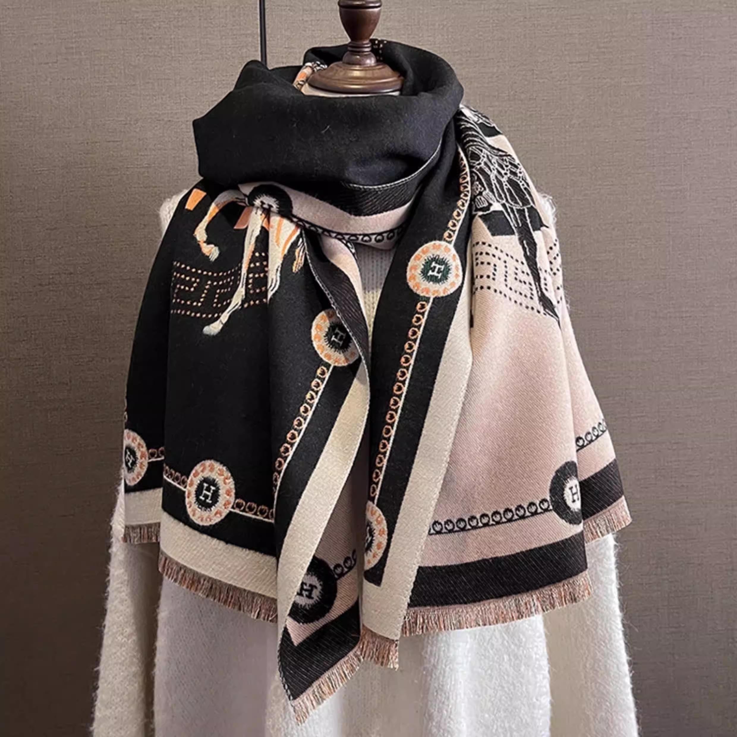 Black luxury style scarf with orange letter and ivory border, styled as winter neck wrap