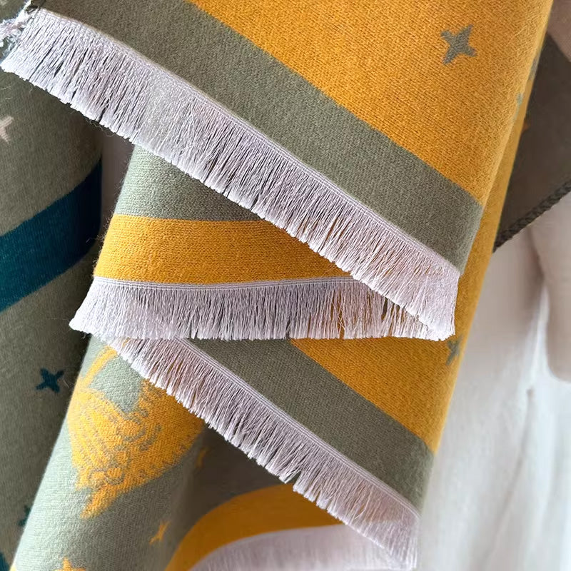 Close-up fringe and texture detail of an olive-green scarf with mustard yellow panel design. The fabric detail shows the winter wrap is very soft and warm, and made with high-quality workmanship. Large size, approx. width 65 cm, length 180 cm and weight 330g