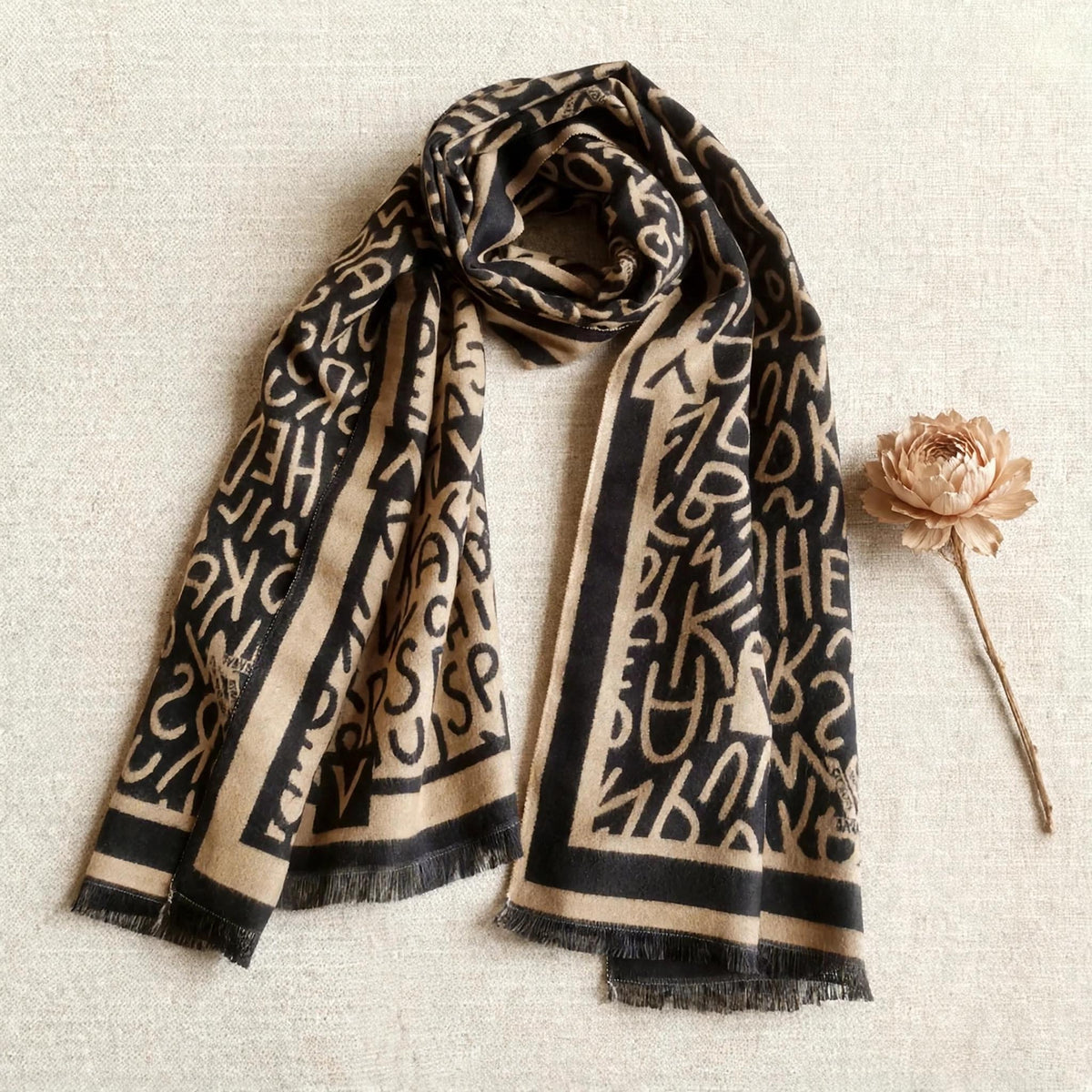fashion winter scarf for both men and women designed in black and brown letter pattern styled on a light background. Crafted with high-quality cashmere-feel fabric. Large size, approx. 65 cm width,  180 cm length and 330g