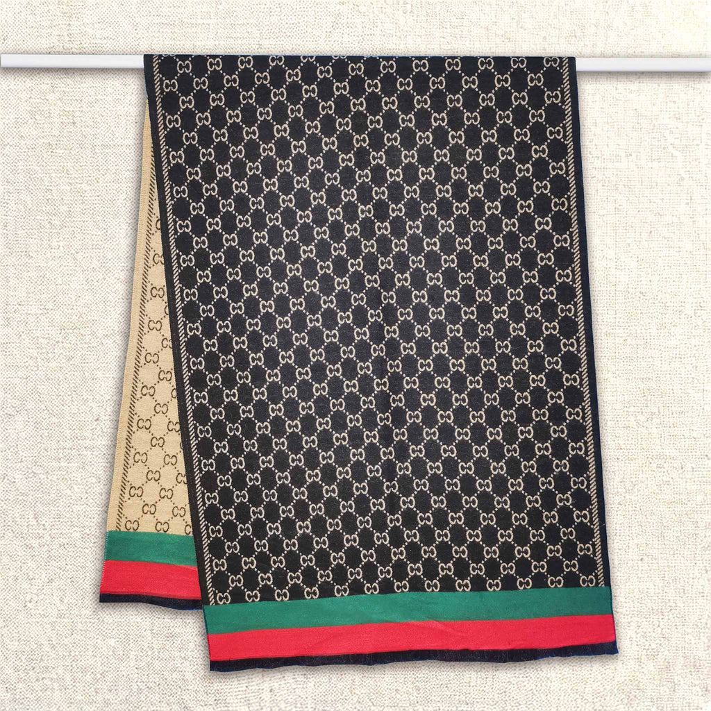 Full view of a double-sided black women scarf with monogram classic pattern is hanging on rod. The fashion winter scarf is crafted from cashmere-feel fabric that is soft, warm and high-quality. Reversible and large size, approx. width 65 cm, length 180 cm and weight 330g