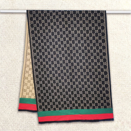 Full view of a double-sided black women scarf with monogram classic pattern is hanging on rod. The fashion winter scarf is crafted from cashmere-feel fabric that is soft, warm and high-quality. Reversible and large size, approx. width 65 cm, length 180 cm and weight 330g