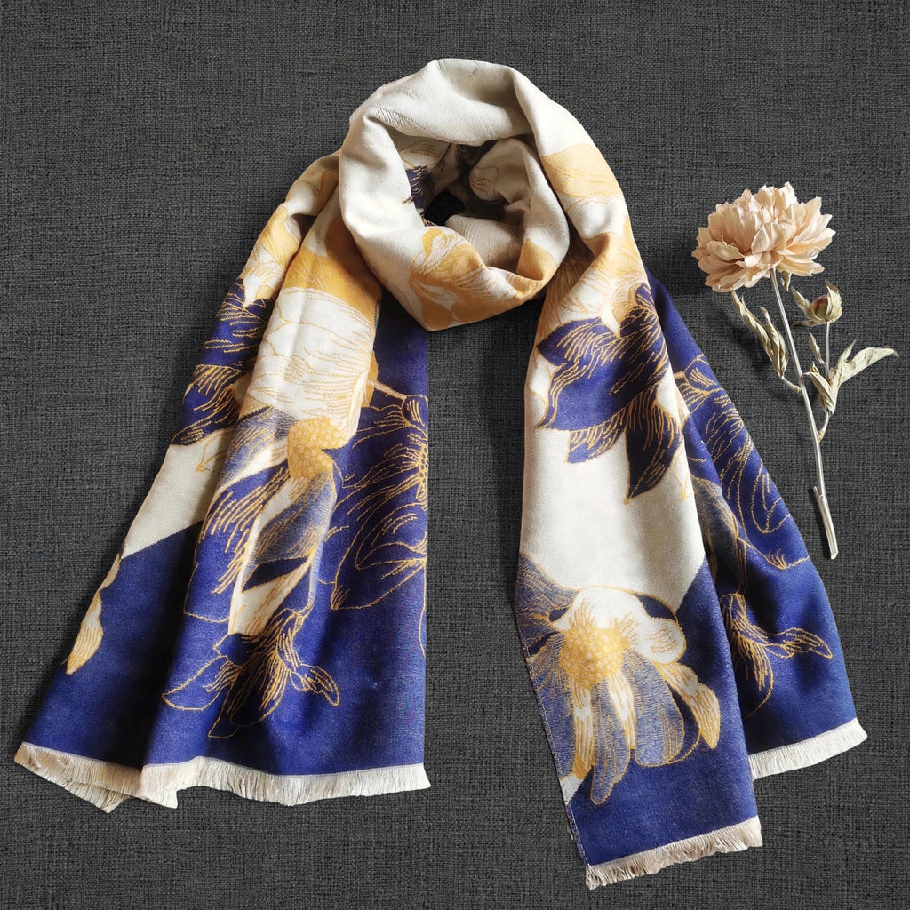 Winter women scarf in navy and yellow floral pattern displayed with dried flower, It is a large size scarf and reversible. Cashmere-feel fabric and the clear pattern crafted with high-end workmanship.