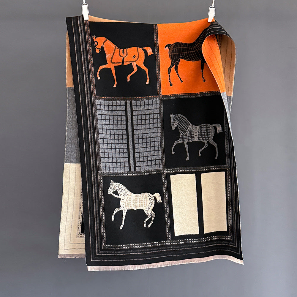 jacquard winter women scarf with equestrian horse print in black white and orange color block design laid flat showing full pattern fringe edges