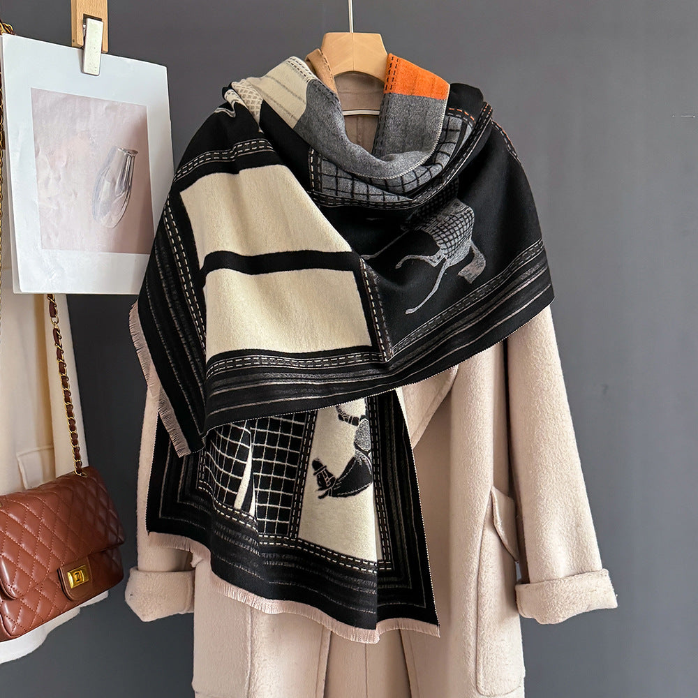 black ivory and orange colorblock and grid design elegant jacquard shawl showing horse motif cashmere-feel fabric draped on hanger with white coat