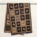 Cashmere-feel winter men scarf featuring brown and black panels with horse-themed pattern, shown hanging on clothing rack