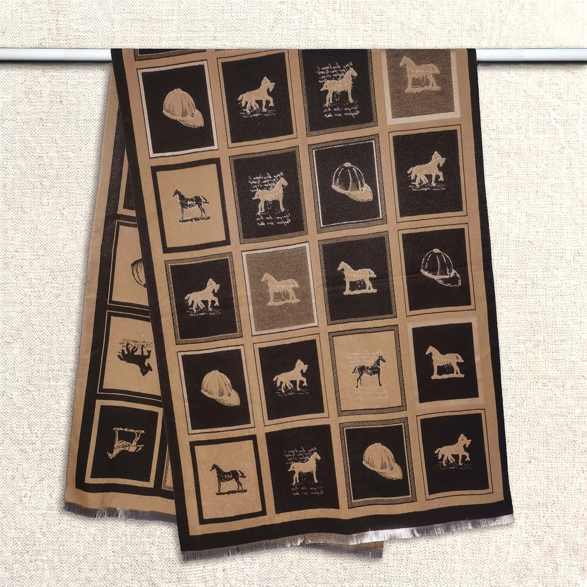 Cashmere-feel winter men scarf featuring brown and black panels with horse-themed pattern, shown hanging on clothing rack