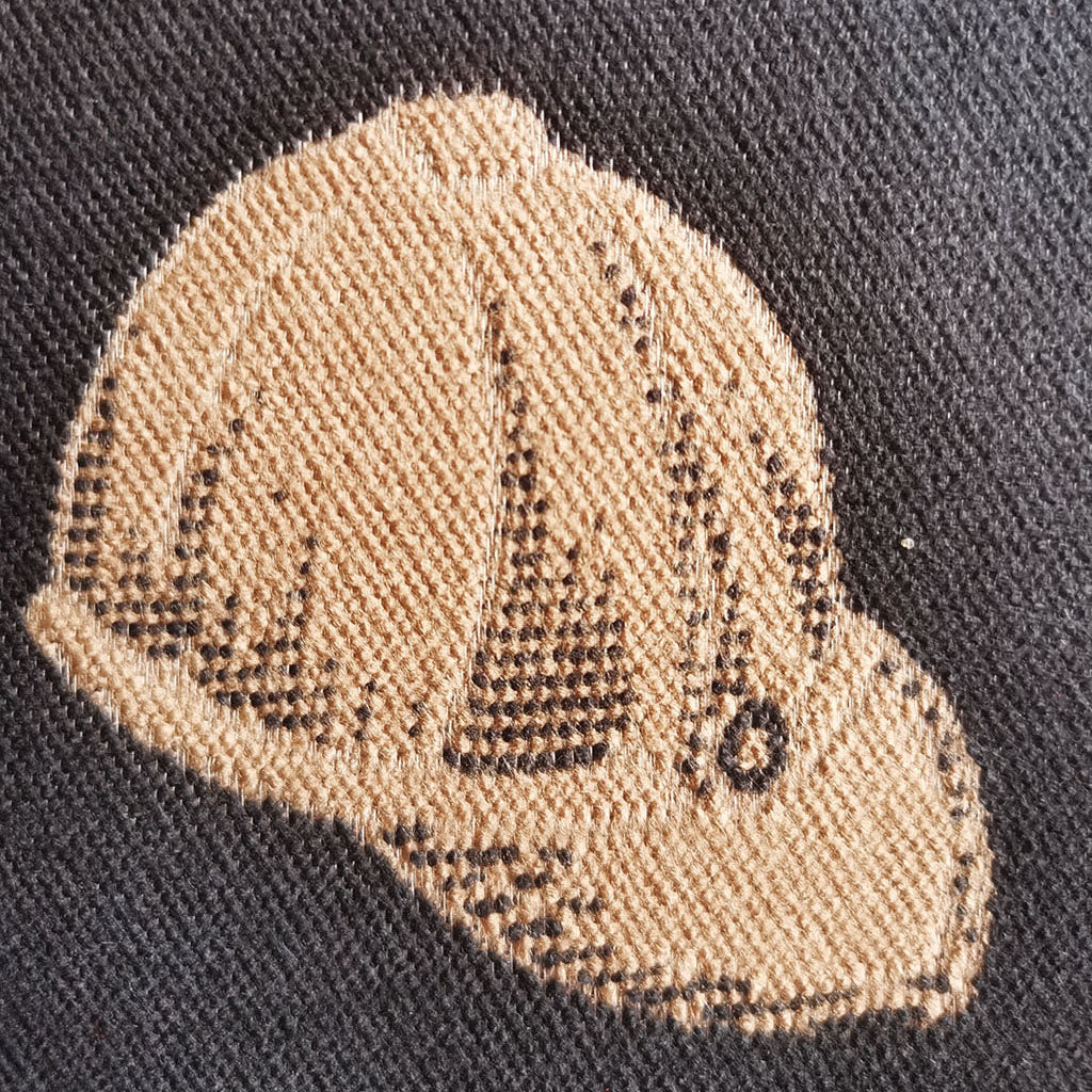 Close-up texture of a black cashmere-feel men scarf. The clear hat pattern indicates the winter scarf is made with high-quality workmanship